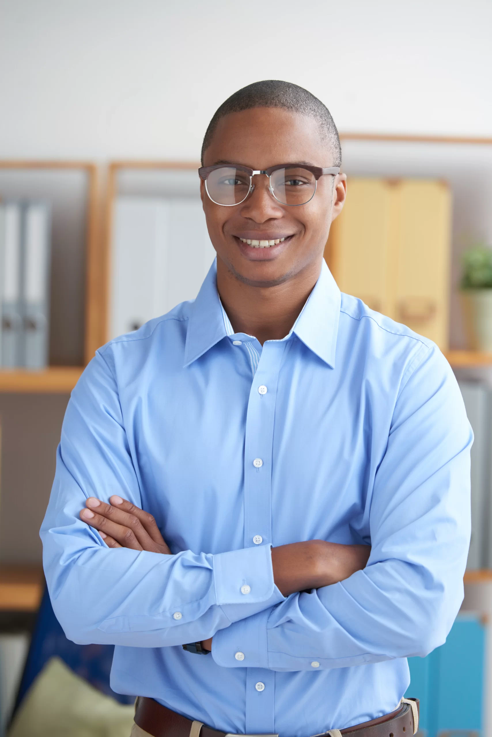 confident entrepreneur looking camera with arms folded smiling
